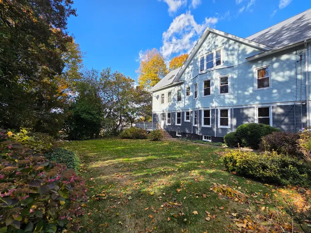 a view of a house with a yard