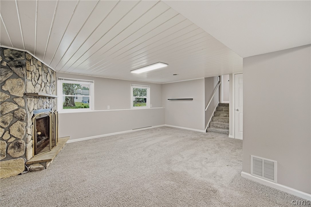4270 Old Meadow Road Clay, NY 13041 - Photo 28 of 41 Large finished lower level with woodburning firepl