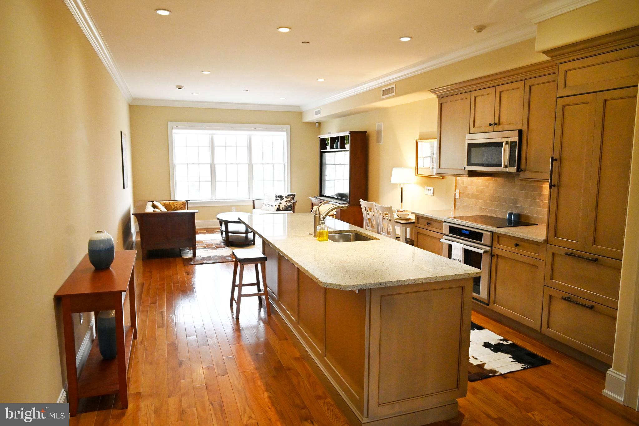 108 East Lancaster Avenue, Unit B2 Wayne, PA 19087 - Photo 11 of 28 Kitchen view into the living space