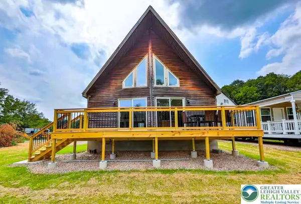 front view of a house with a swimming pool