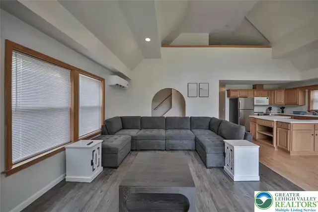 a living room with furniture and a large window