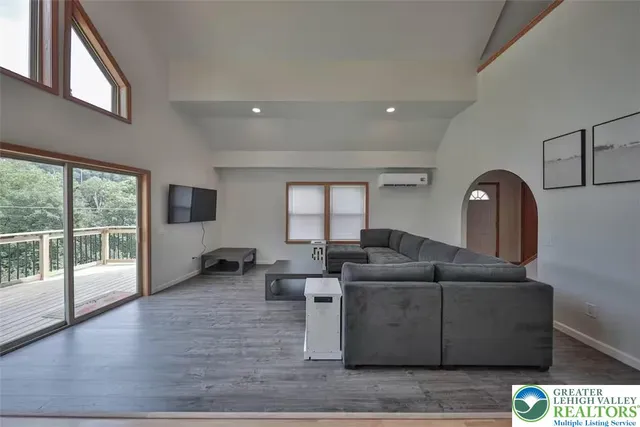 a living room with furniture and a large window