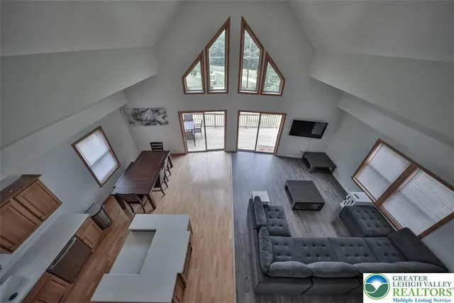 a view of living room and dining room with furniture