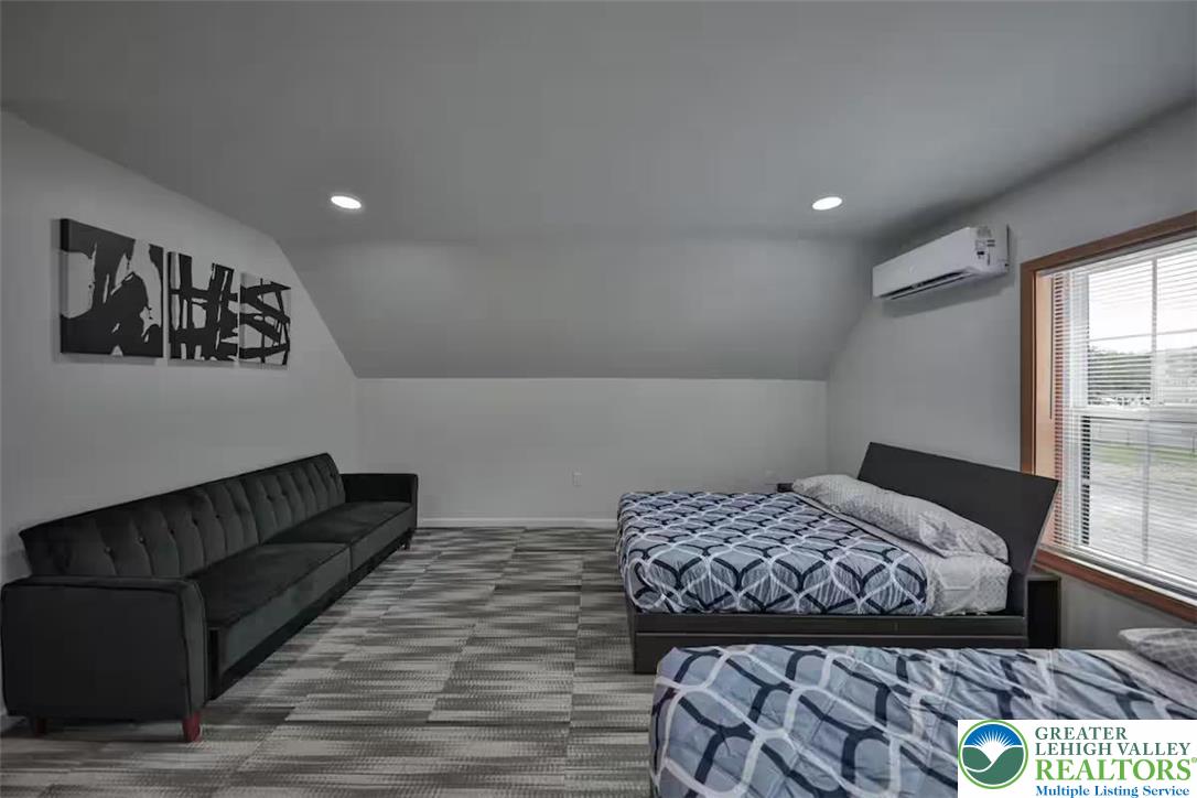 1500 Rock Street, Unit 2 Lehighton, PA 18235 - Photo 21 of 42 a bedroom with a bed and wooden floor