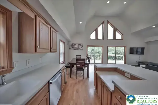 a kitchen with sink stove and cabinets