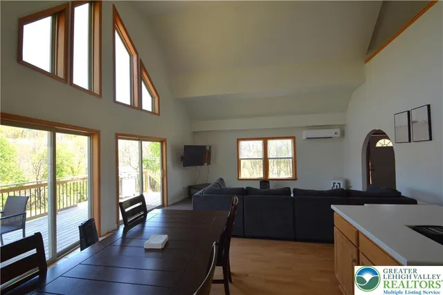 a living room with furniture window and wooden floor