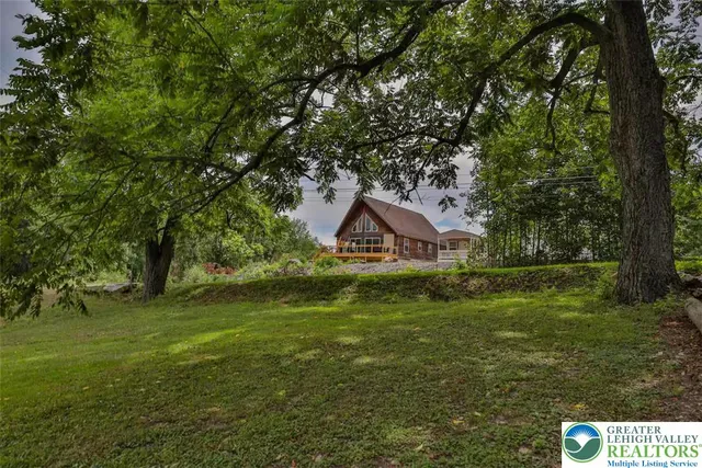 a backyard of a house with lots of green space