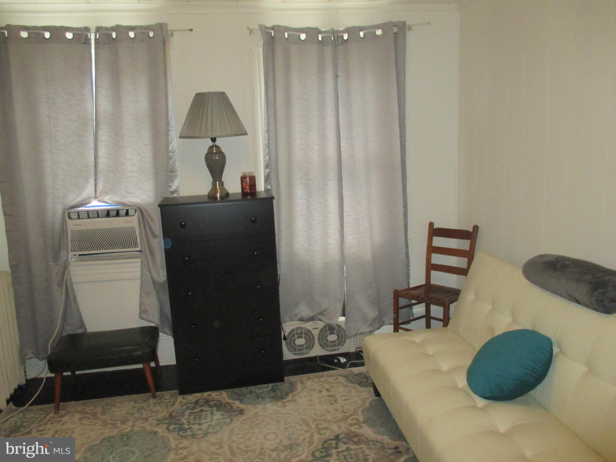 333 Pratt Street Luke, MD 21540 - Photo 24 of 42 a living room with furniture and a lamp
