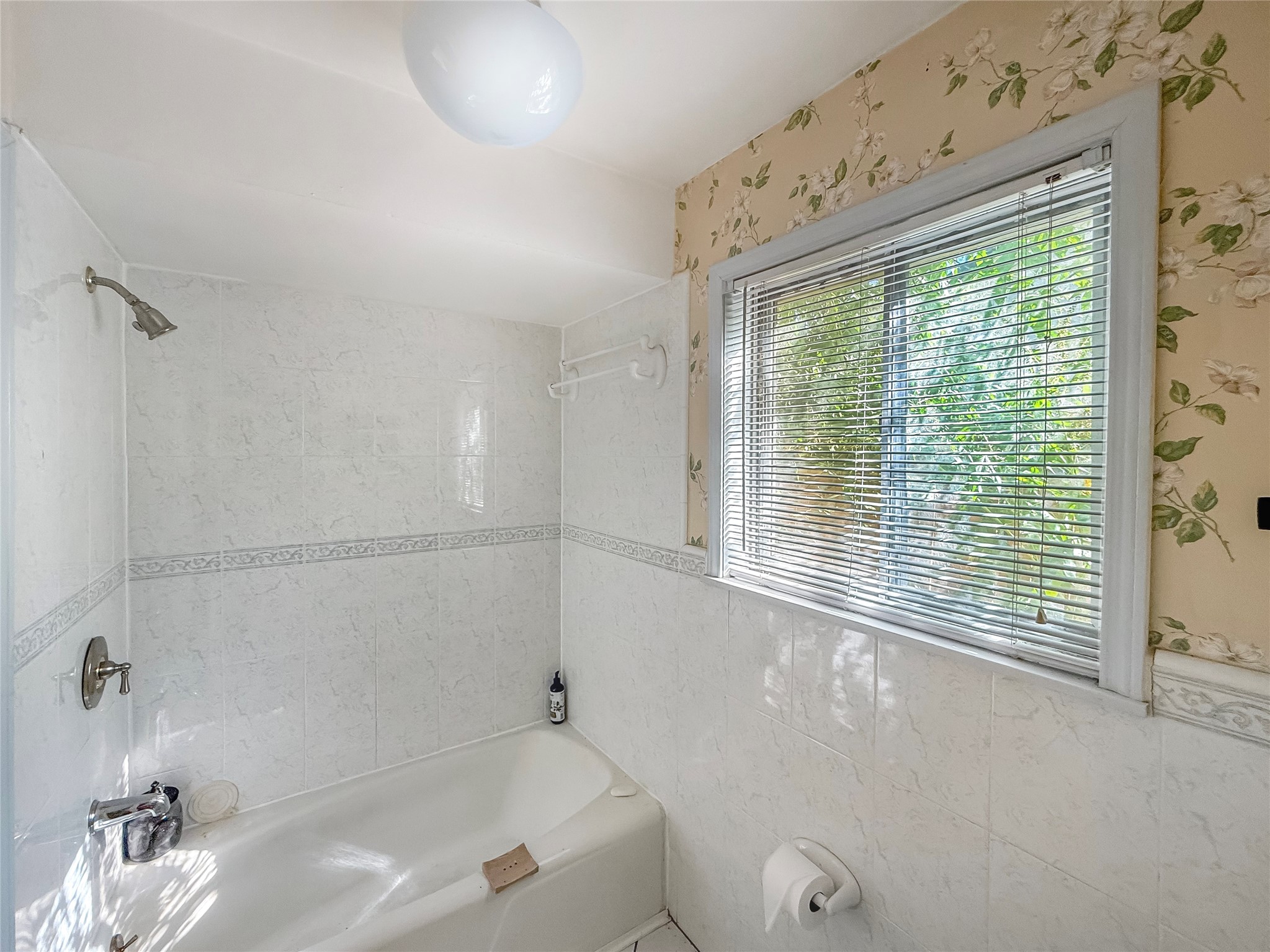 7906 Del Rey Lane Houston, TX 77071 - Photo 13 of 16 a bathroom with a bathtub and a shower