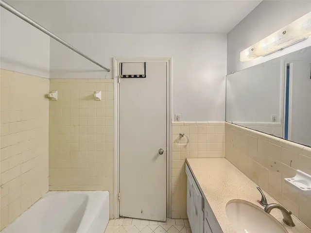 a bathroom with a sink and shower