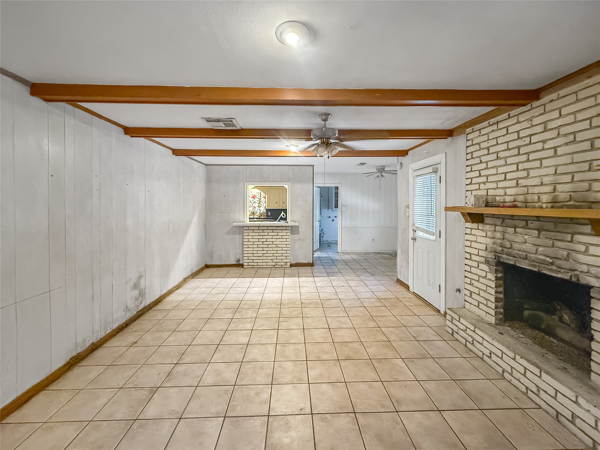 7906 Del Rey Lane Houston, TX 77071 - Photo 5 of 16 a view of empty room with a fireplace and fan