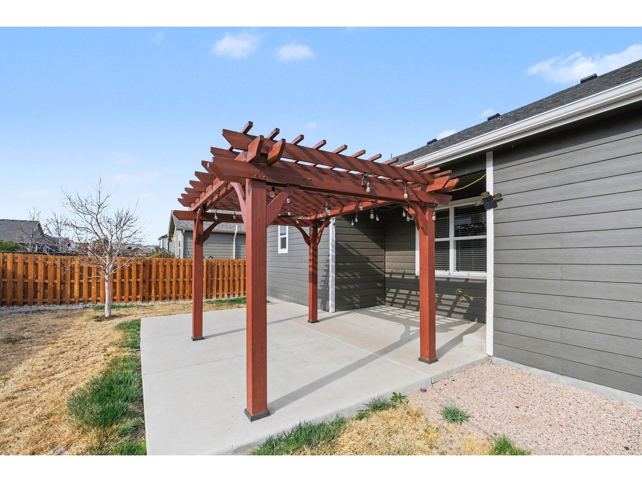 7347 Atlantis Street Wellington, CO 80549 - Photo 16 of 23 Spacious patio with beautifully crafted wood pergola