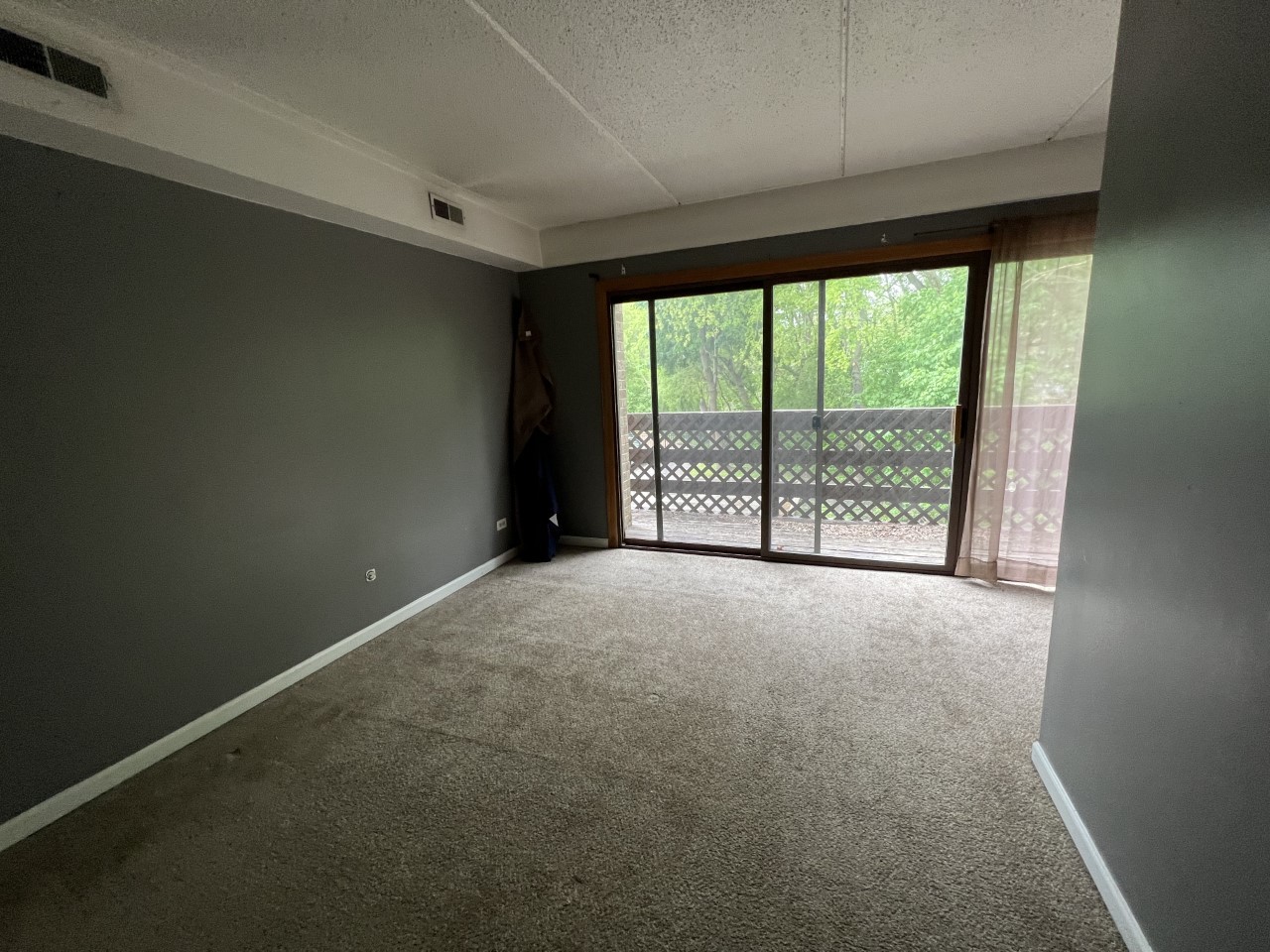 410 Kenneth Circle Elgin, IL 60120 - Photo 9 of 15 an empty room with large windows