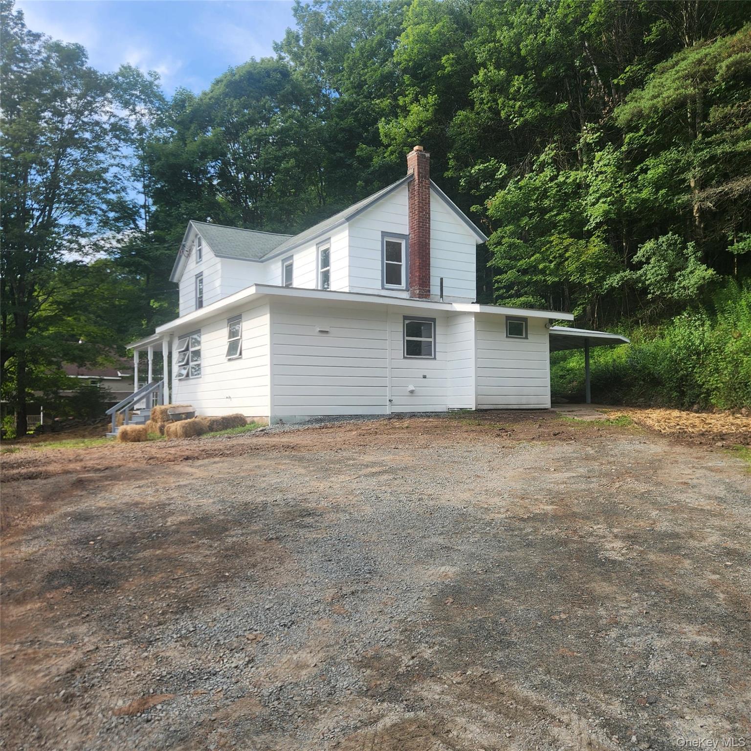 476 Old Rte 17 Livingston Manor, NY 12758 - Photo 24 of 39 View of home's exterior featuring a chimney and driveway