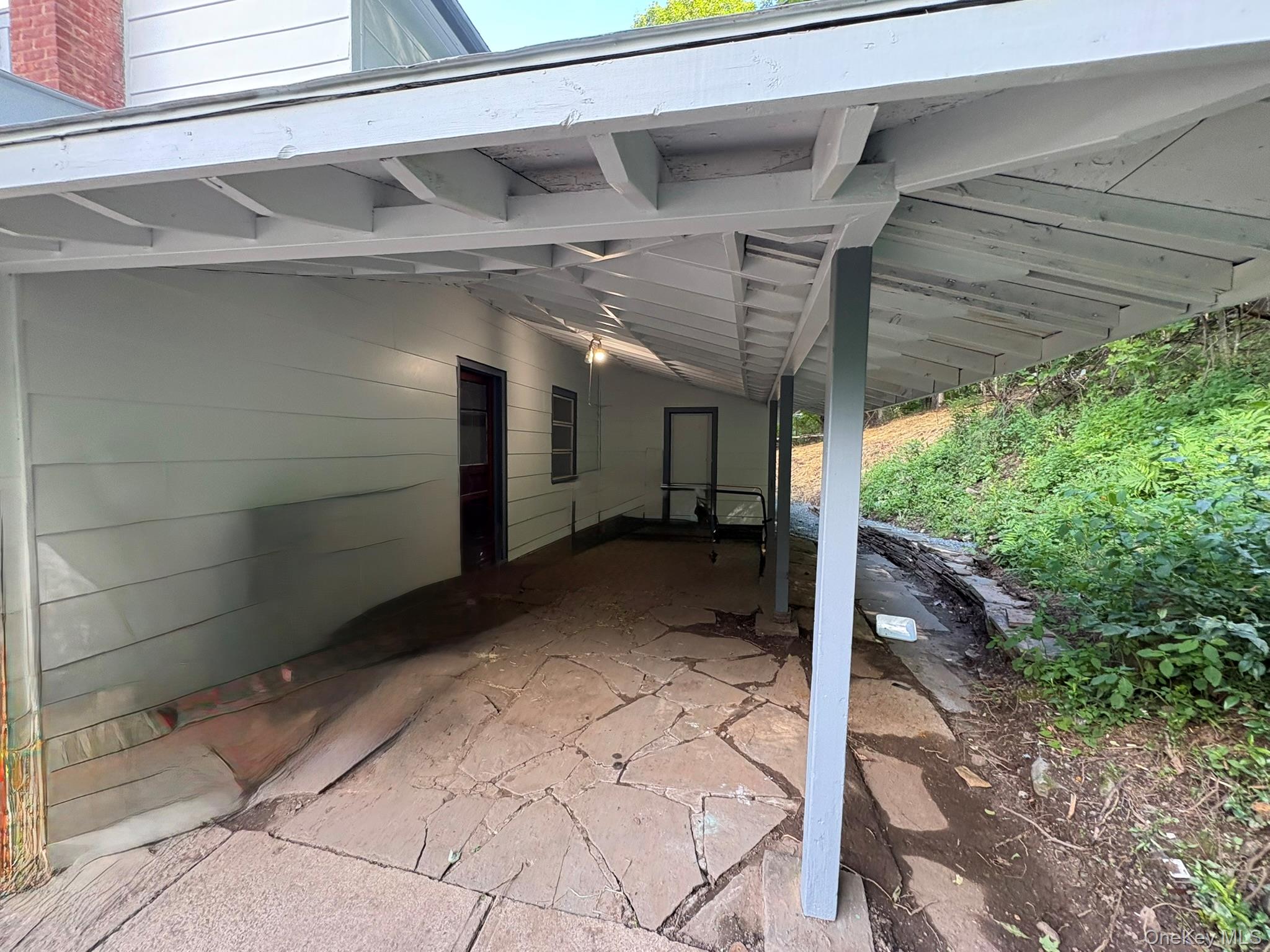 476 Old Rte 17 Livingston Manor, NY 12758 - Photo 37 of 39 View of patio / terrace with an attached carport
