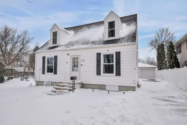 a view of house with a yard