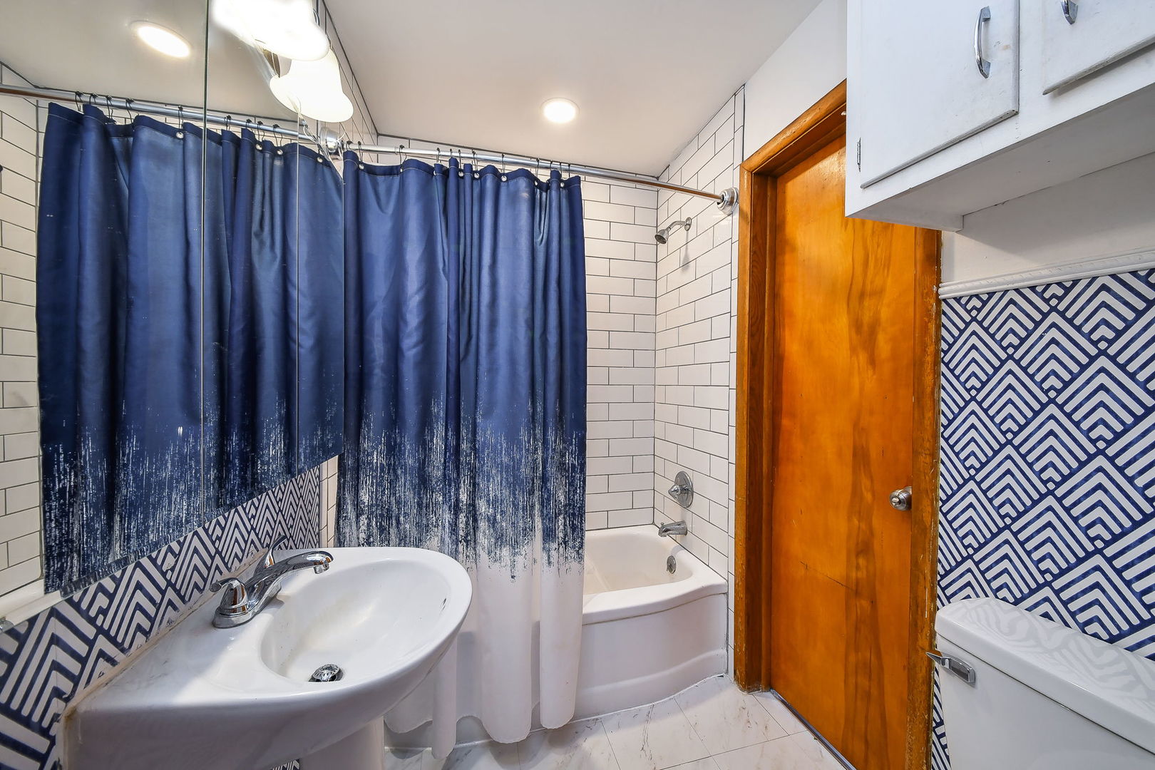 118 Stiles Street Genoa, IL 60135 - Photo 11 of 21 a bathroom with a sink toilet and shower