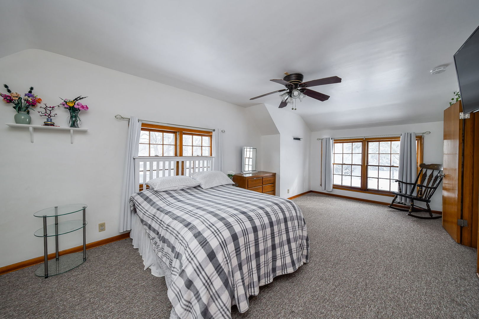 118 Stiles Street Genoa, IL 60135 - Photo 15 of 21 a bedroom with a bed and a chandelier