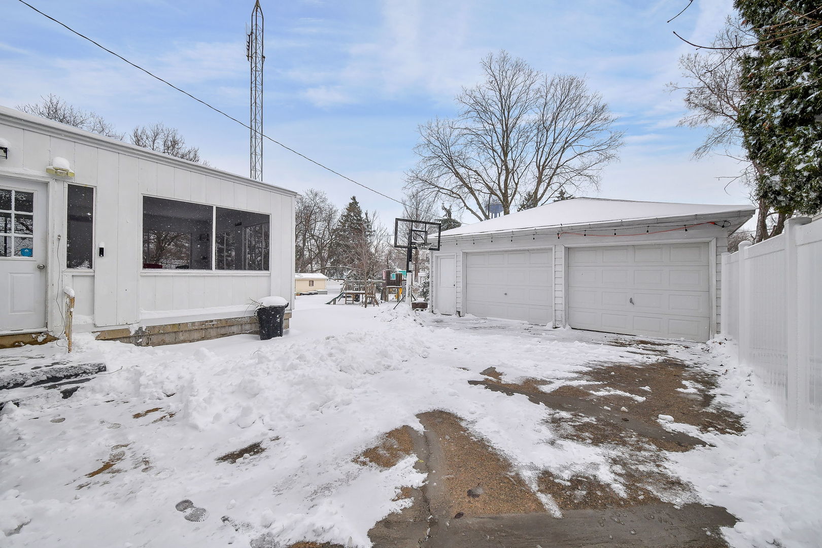 118 Stiles Street Genoa, IL 60135 - Photo 19 of 21 a view of a house with a snow in the yard