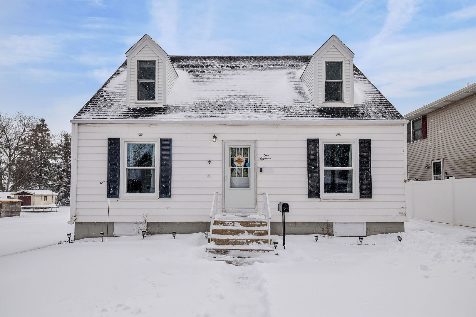 118 Stiles Street Genoa, IL 60135 - Photo 2 of 21 a front view of a house with a garage