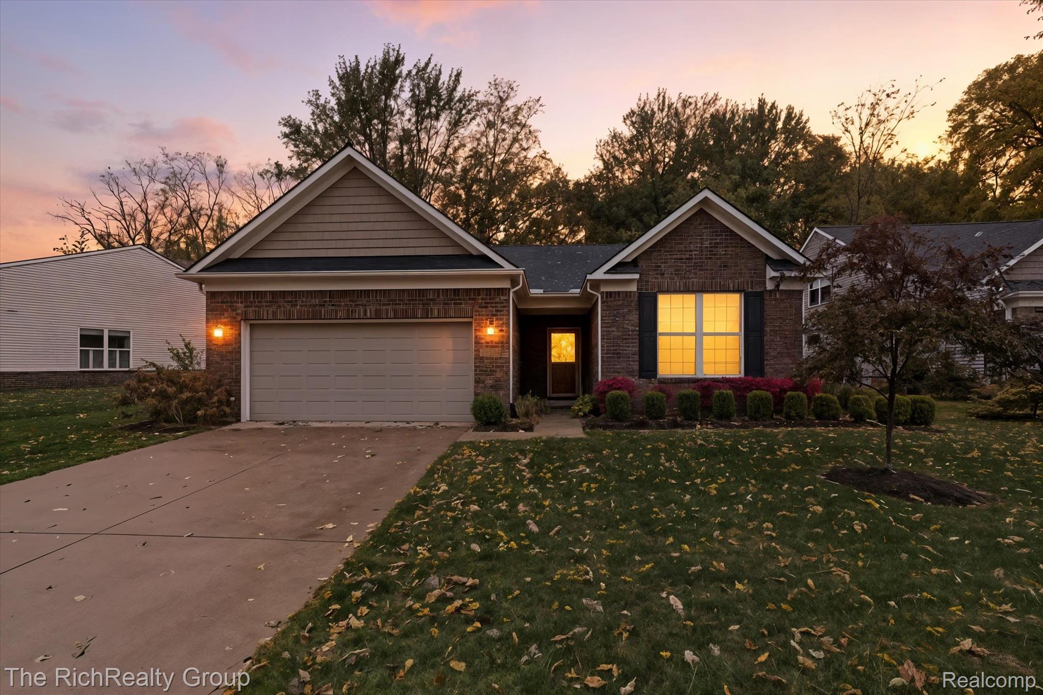 49534 Mapleton Road Canton, MI 48188 - Photo 1 of 37 Ranch-style home featuring concrete driveway, a lawn, brick siding, and a garage