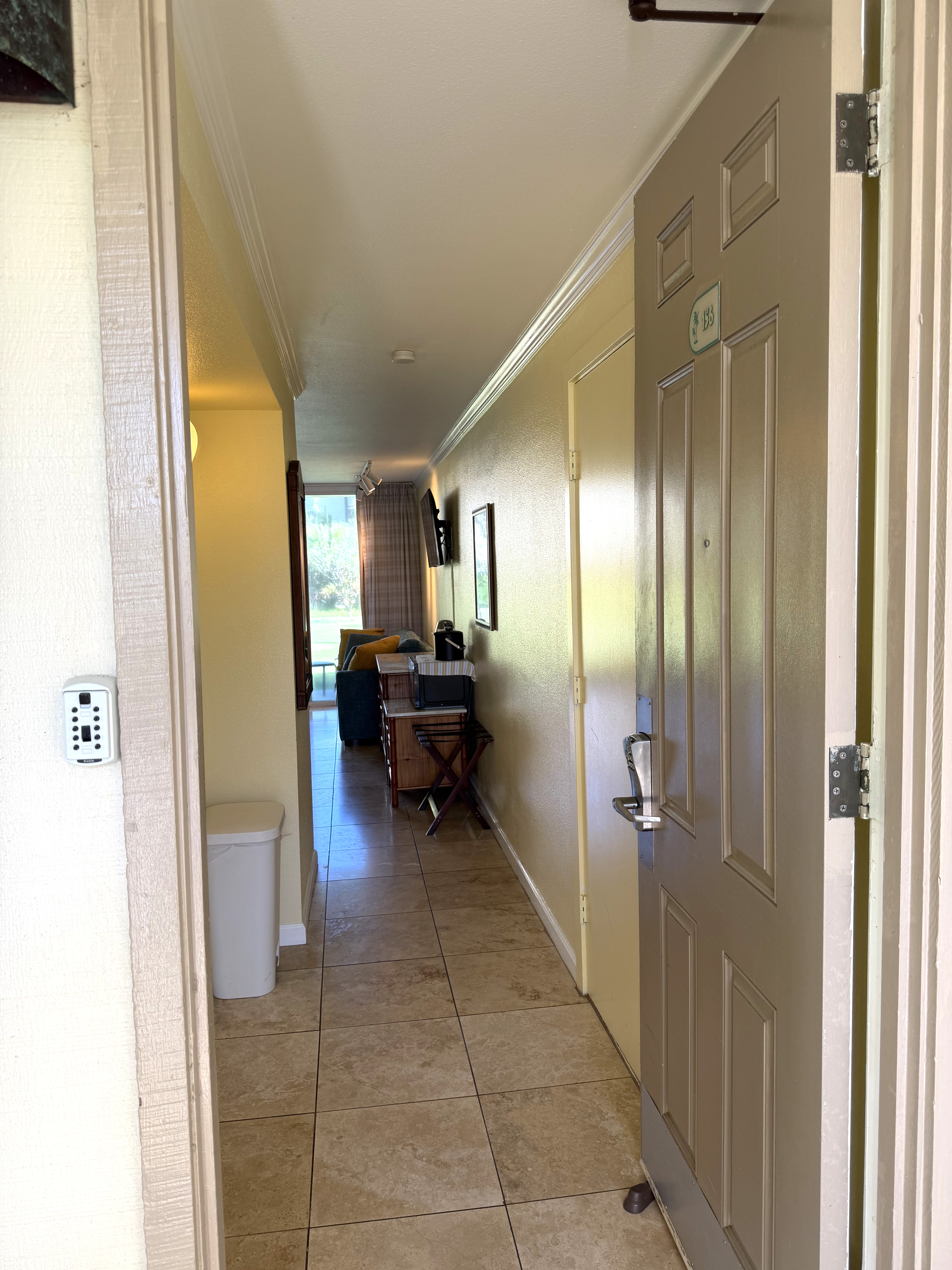 440 Aleka Place, Unit 156 Kapaa, HI 96746 - Photo 15 of 27 a view of a hallway with furniture and a livingroom view