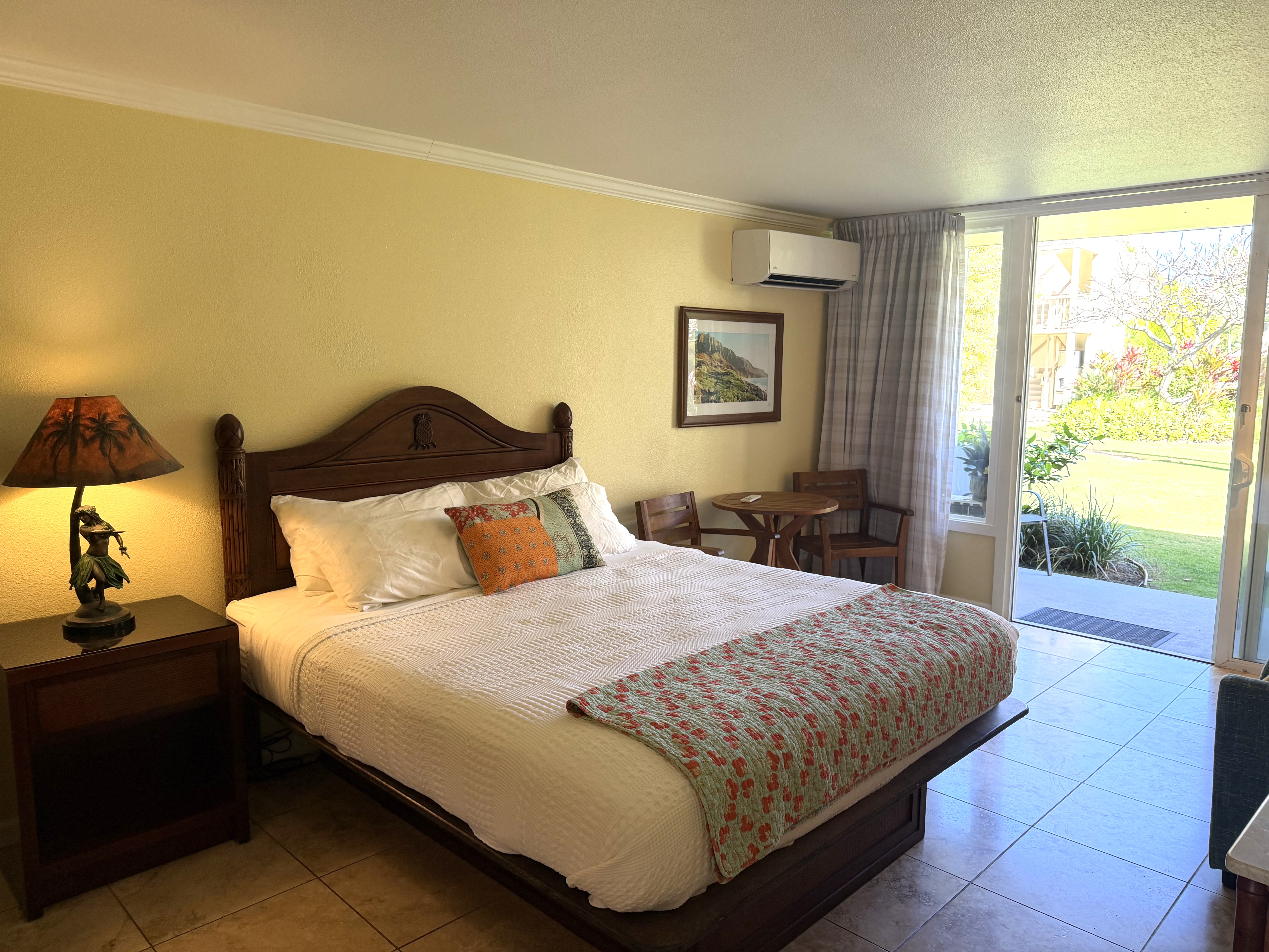 440 Aleka Place, Unit 156 Kapaa, HI 96746 - Photo 3 of 27 a bedroom with a bed and wooden floor