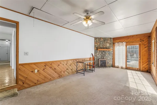 a view of an empty room with a window