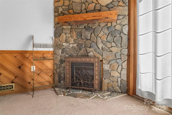 a view of a fireplace with an empty room