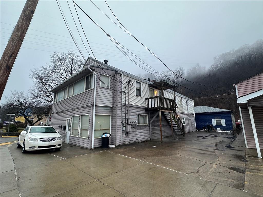 1023-1027 Freeport Road Creighton, PA 15030 - Photo 5 of 12 a view of a car park in front of house