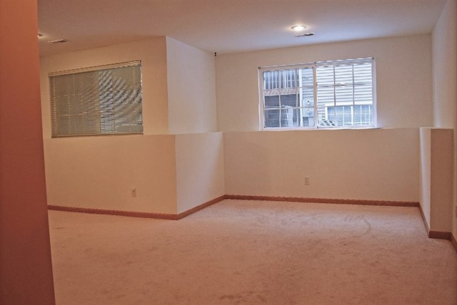 626 South Peace Road Sycamore, IL 60178 - Photo 17 of 24 an empty room with windows