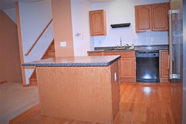 626 South Peace Road Sycamore, IL 60178 - Photo 5 of 24 a kitchen with granite countertop a sink and a stove