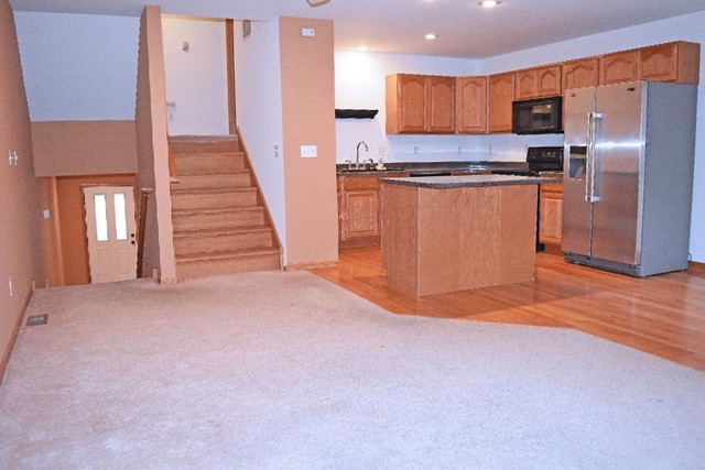 626 South Peace Road Sycamore, IL 60178 - Photo 7 of 24 a view of kitchen with wooden floor and electronic appliances