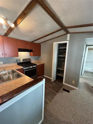 a view of hallway with bathroom