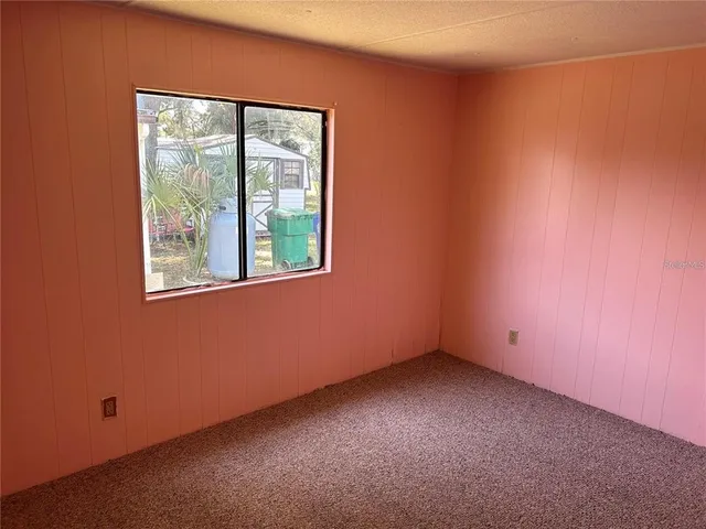 a white toilet sitting next to a bathroom sink and vanity