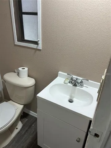 a view of a room with white walls and stairs