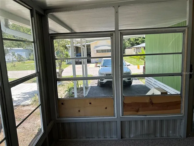 a view of a room that has a window