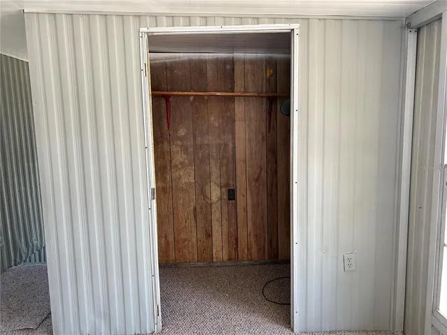 a view of a room with windows