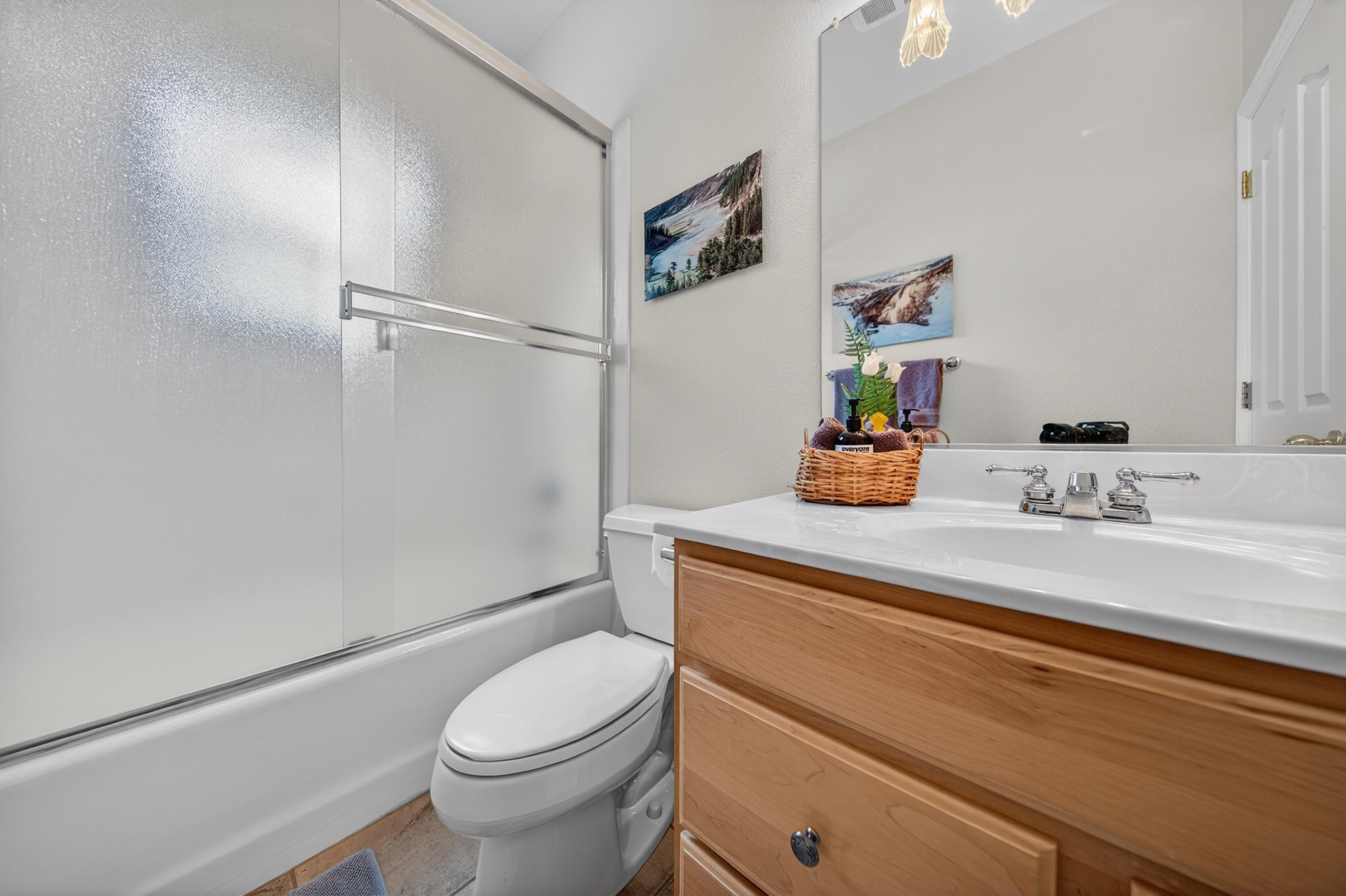1017 Timber Ridge Road Lake Almanor, CA 96137 - Photo 26 of 45 a bathroom with a sink a toilet and shower