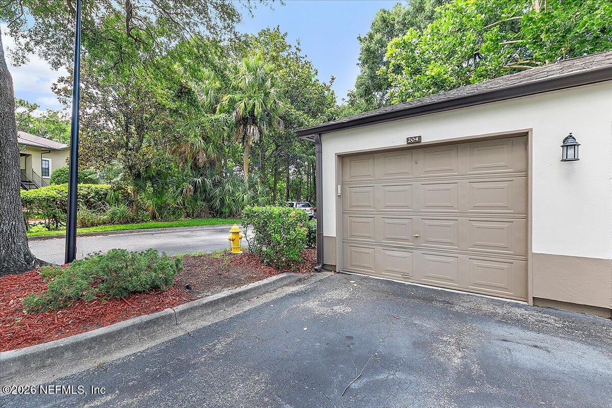 10150 Belle Rive Boulevard, Unit 204 Jacksonville, FL 32256 - Photo 9 of 19 09-Garage Exterior