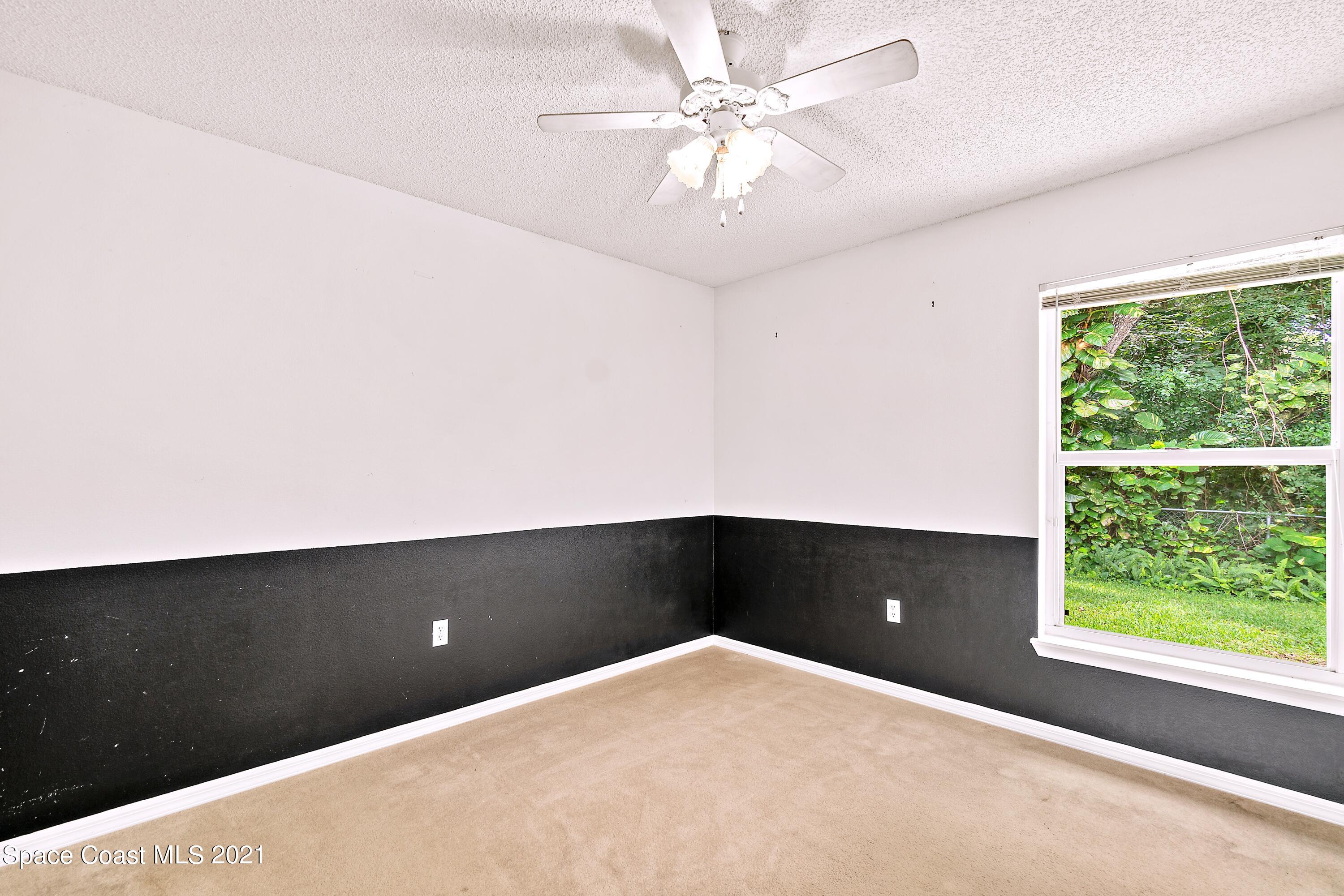 7250 Camilo Road Cocoa, FL 32927 - Photo 28 of 45 an empty room with a window