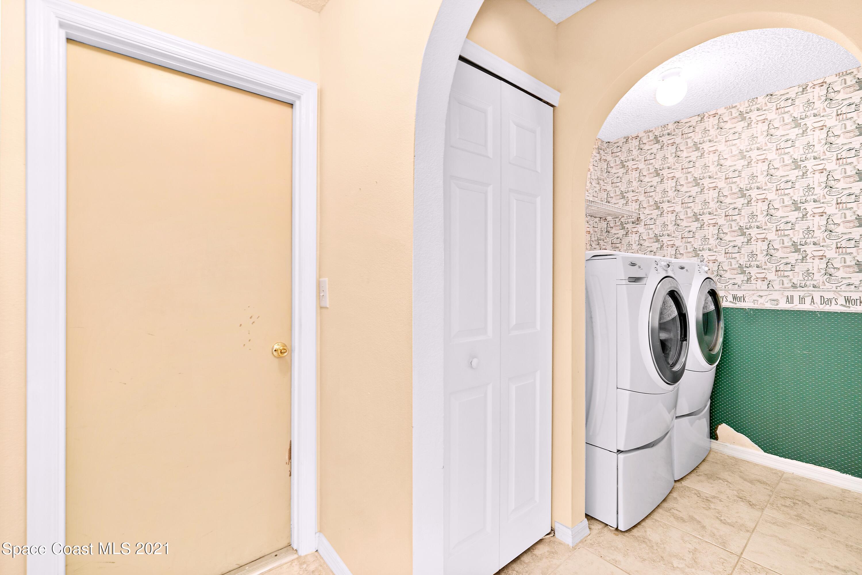7250 Camilo Road Cocoa, FL 32927 - Photo 34 of 45 a utility room with dryer and washer