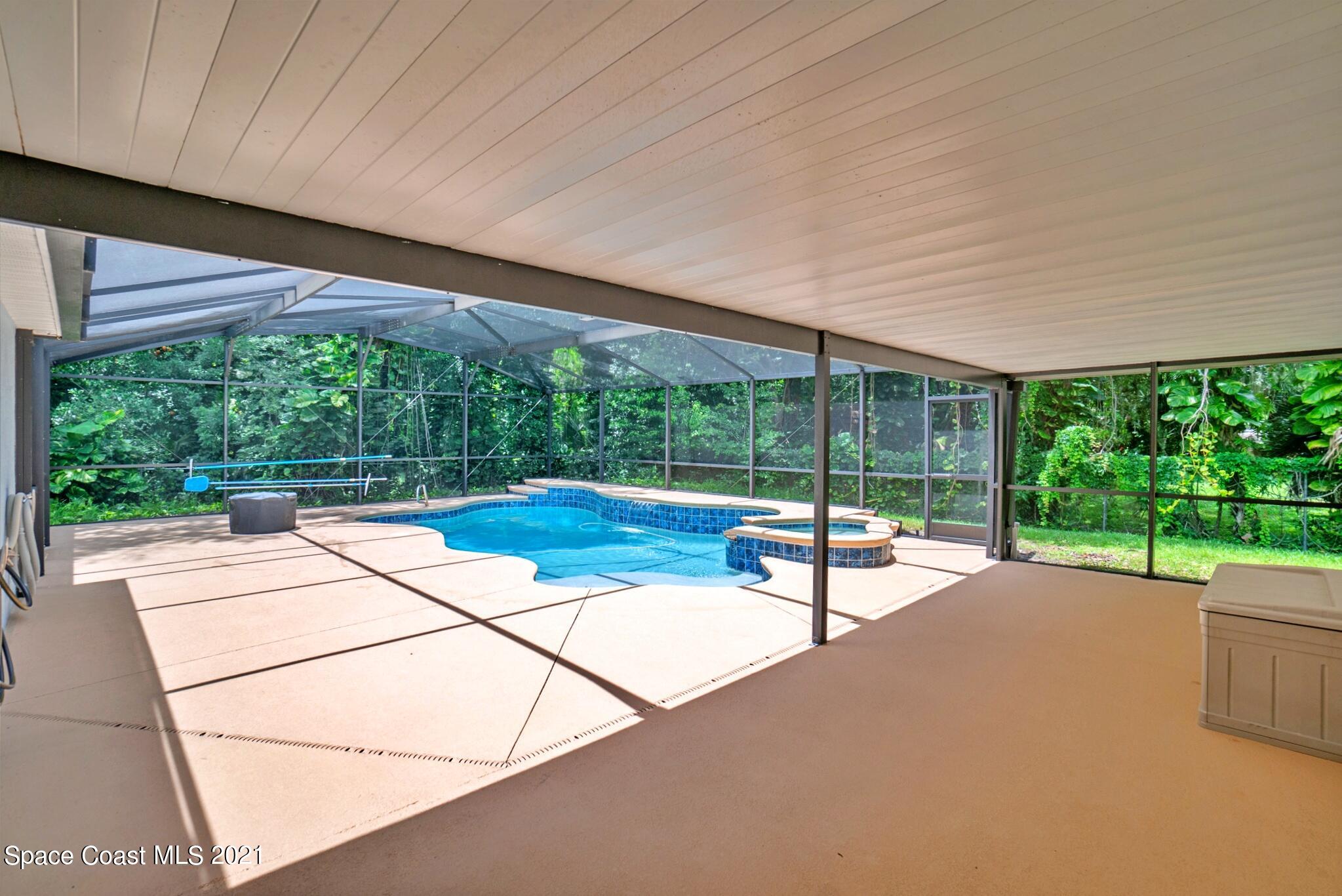 7250 Camilo Road Cocoa, FL 32927 - Photo 35 of 45 a building with pool table and outdoor seating