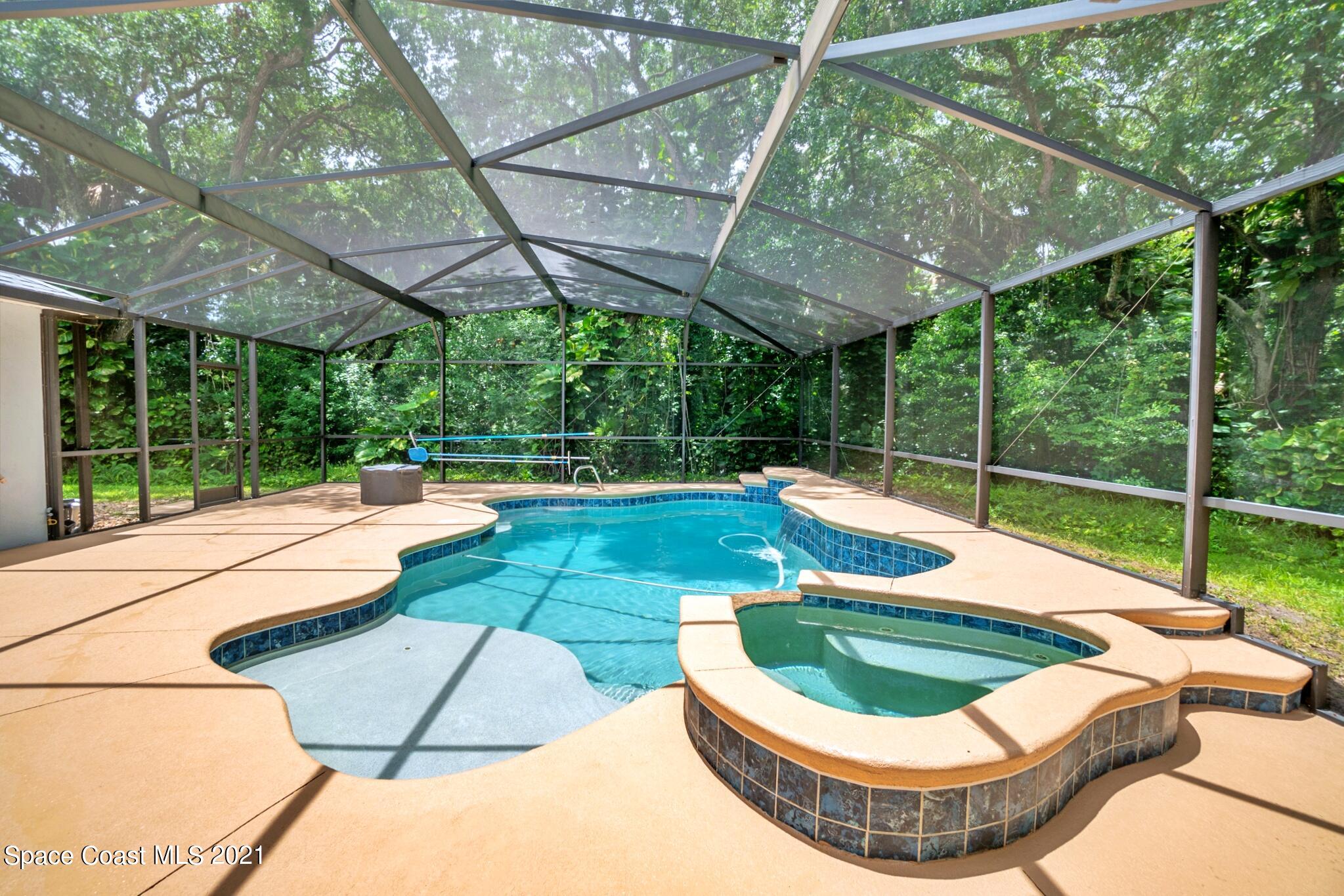 7250 Camilo Road Cocoa, FL 32927 - Photo 37 of 45 a view of a swimming pool with a porch