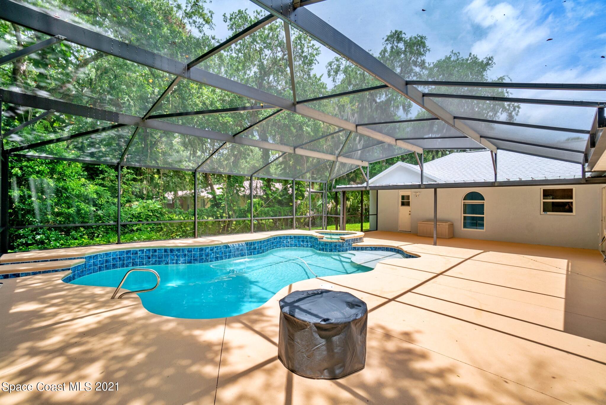 7250 Camilo Road Cocoa, FL 32927 - Photo 39 of 45 a view of a swimming pool with a patio