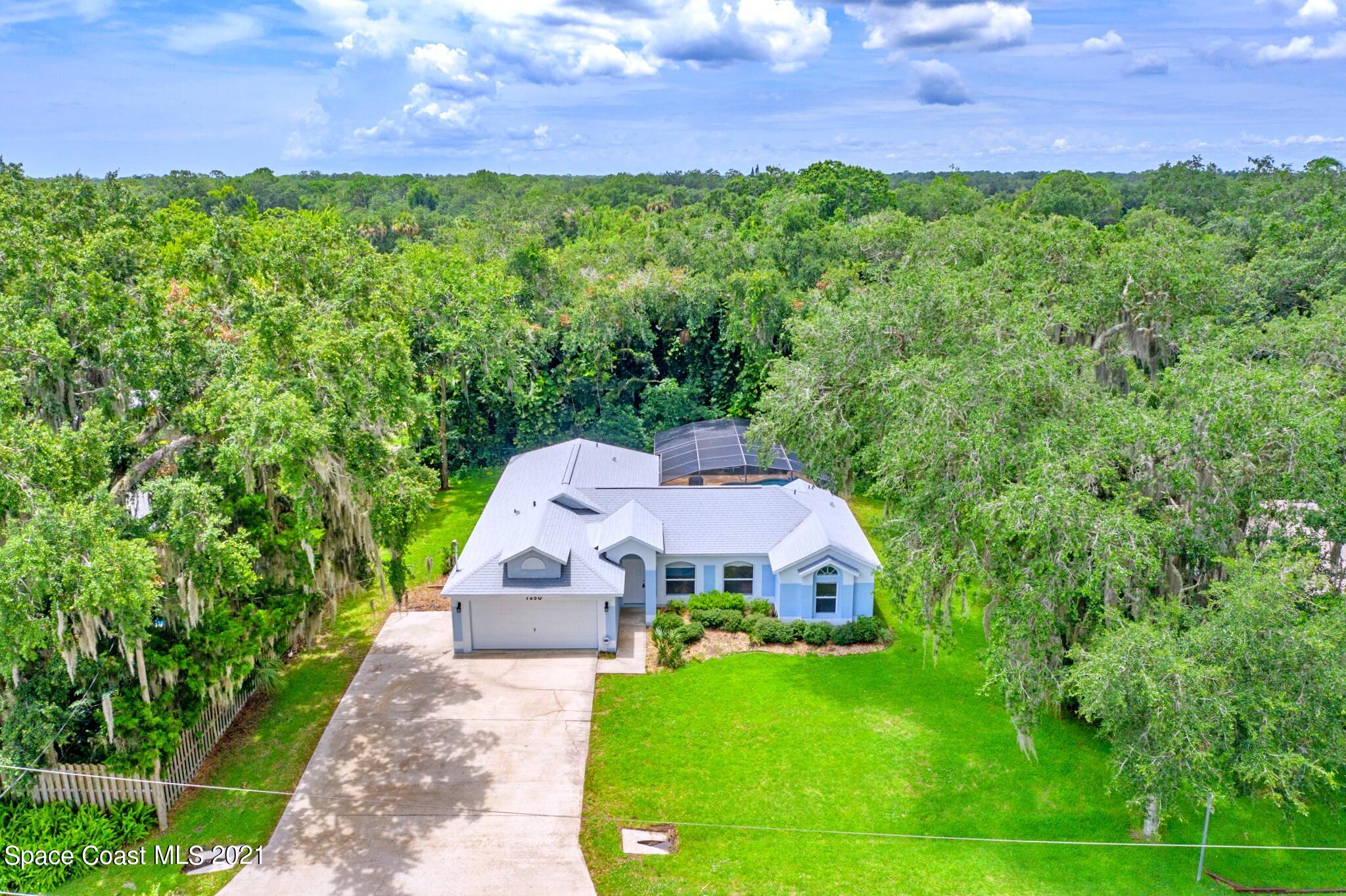 7250 Camilo Road Cocoa, FL 32927 - Photo 43 of 45 a aerial view of a house with a yard