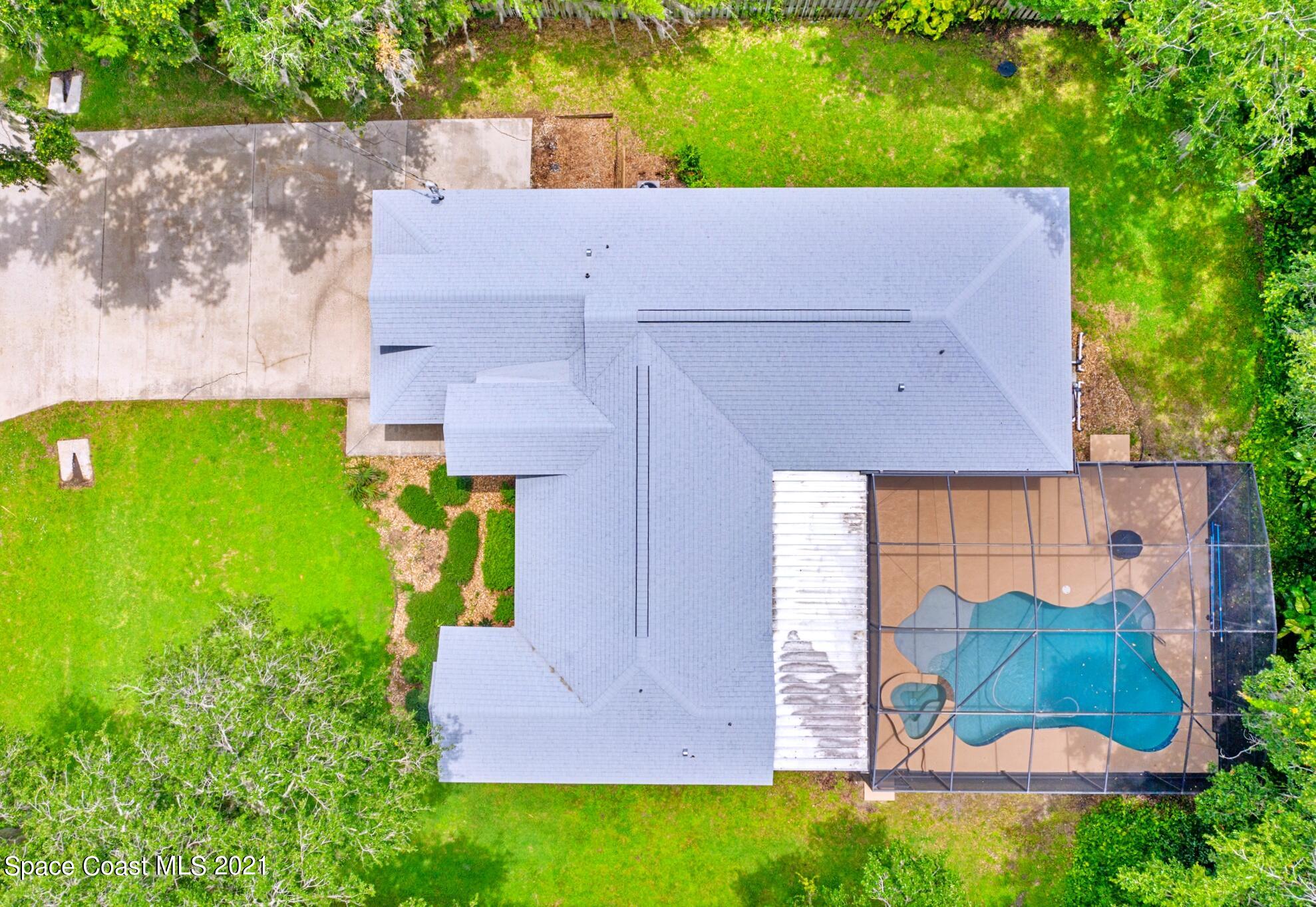 7250 Camilo Road Cocoa, FL 32927 - Photo 44 of 45 an aerial view of a house with garden space and street view
