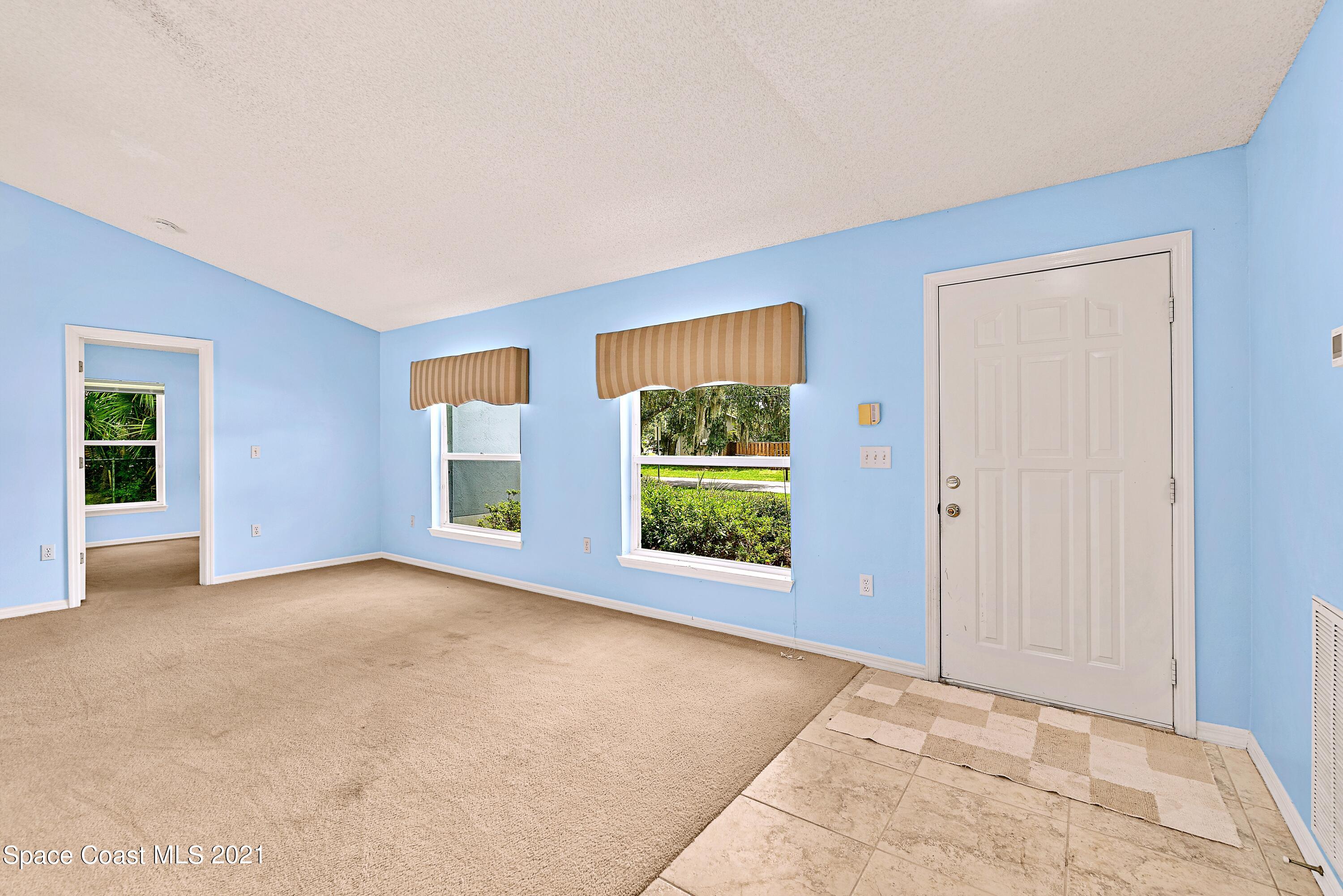 7250 Camilo Road Cocoa, FL 32927 - Photo 7 of 45 an empty room with windows