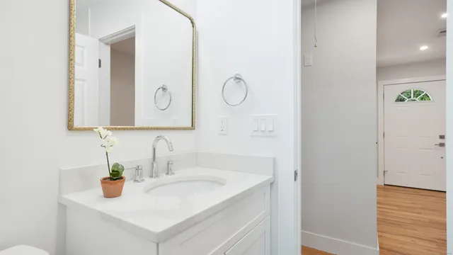 a bathroom with a sink and a mirror