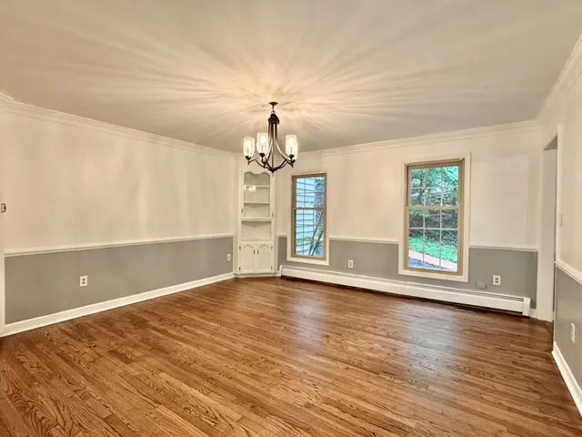 a bedroom with a bed and a ceiling fan